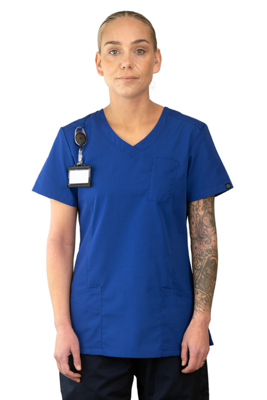 Person wearing a blue scrub top with a name tag.